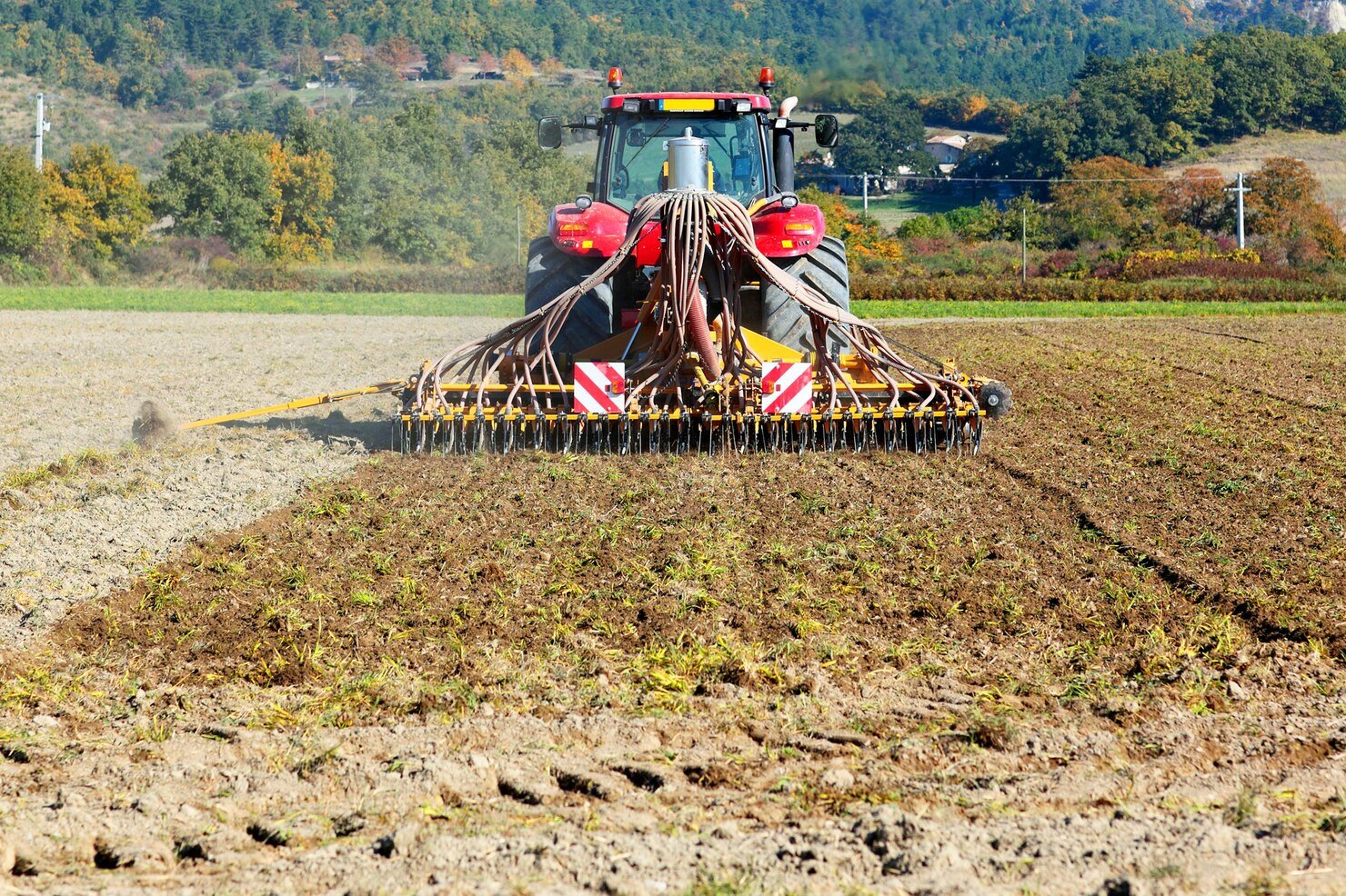 ploughing heavy tractor cultivation agriculture works field with plough_268835 915